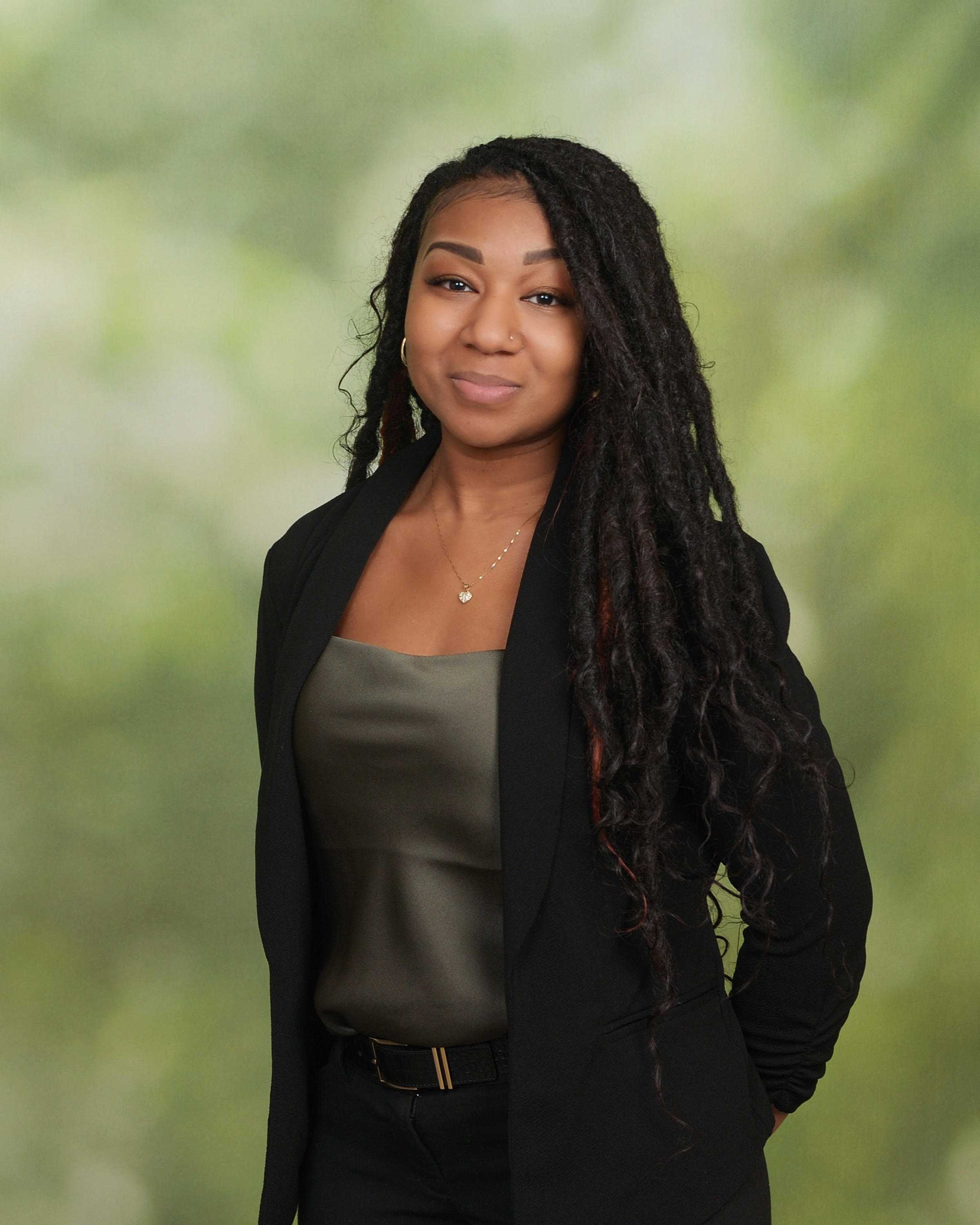 Kendy Jean-Louis, Pennsylvania notary public, smiling in professional attire